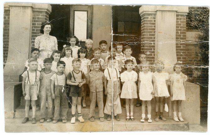 Damaged vintage class photo before restoration